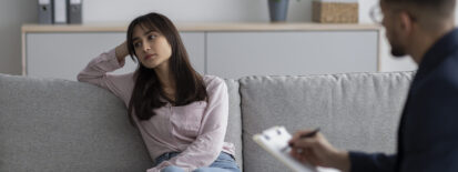 Woman lounging on couch. Is your trauma therapist trauma-informed? Are you trying to find a therapist near me who offers trauma-informed care? Read on and learn how to identify a trauma-informed therapist! Los Angeles 90210 | 90077 | 90272 | Miami, FL 33131 | Newark, NJ 07102 | Jersey City, NJ 07307