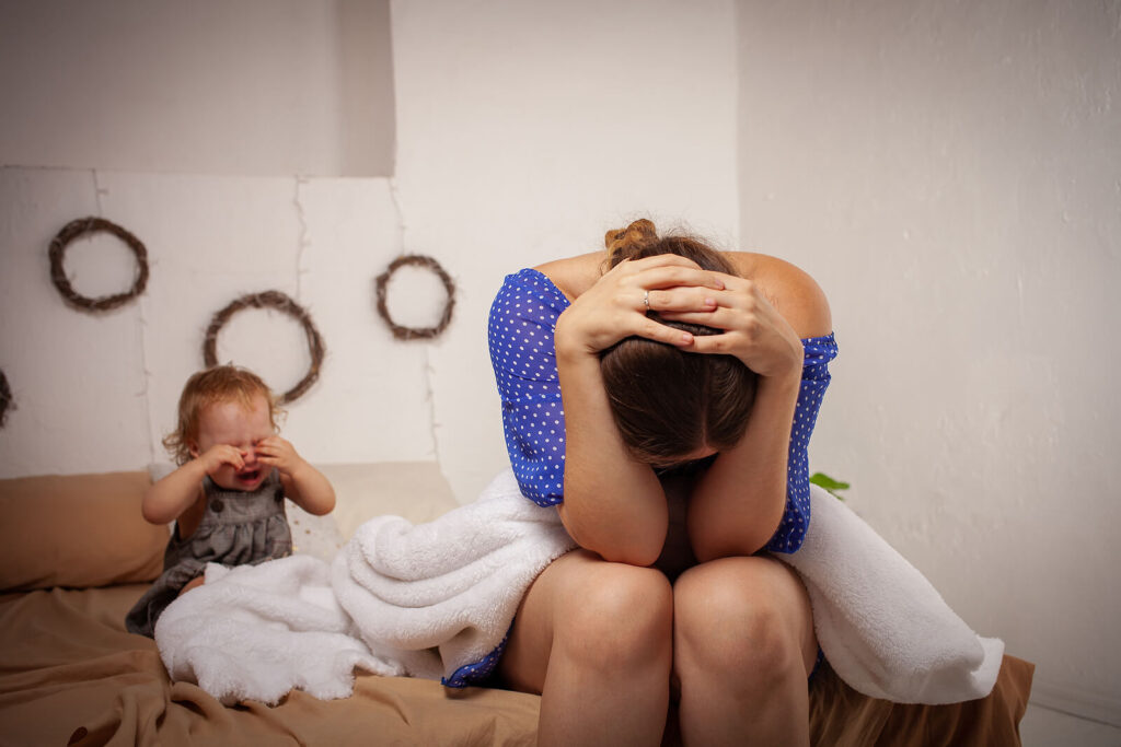 Image of a crying child and upset mother. Have you been searching “find a trauma therapist near me”? Do you need help understanding children? In this trauma blog, a trauma therapist explains how. Get help understanding children today. Newark, NJ 07102 | Montgomery, AL 36109
